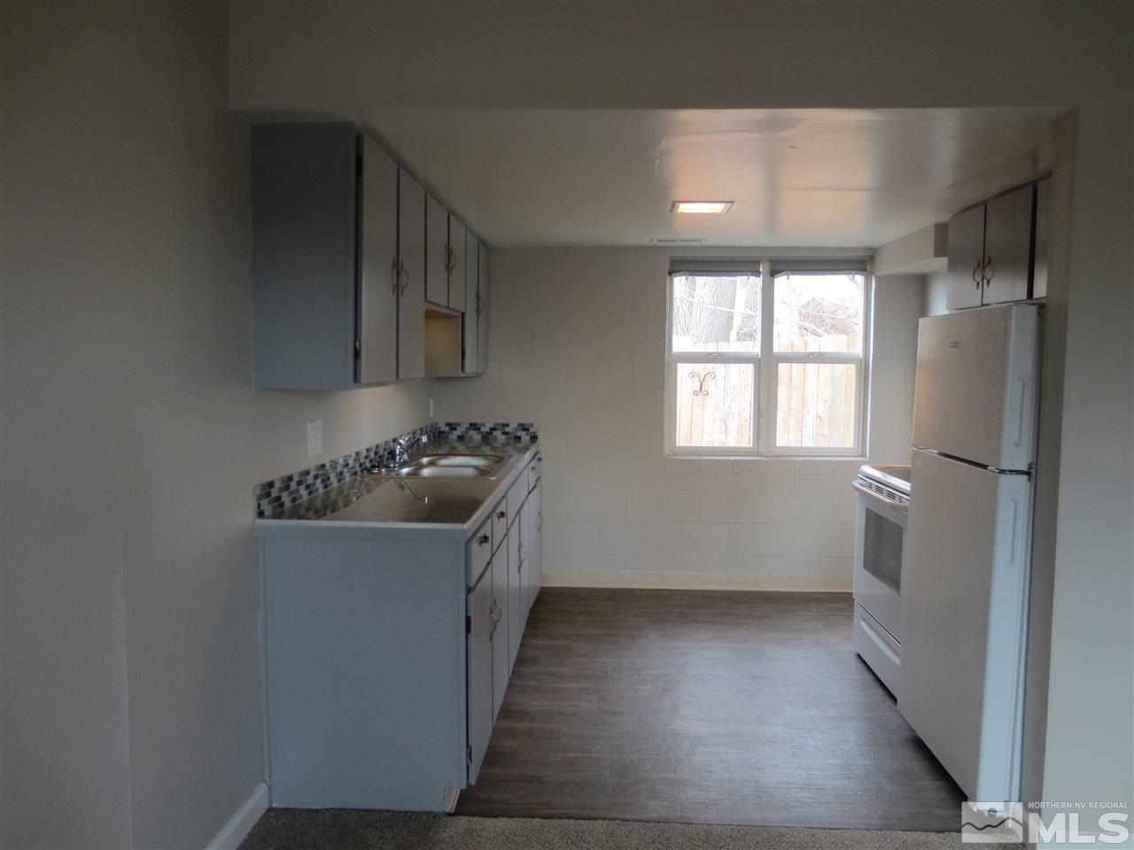 2133 Patton Drive Reno, NV 89512 - Photo 10 of 23 a kitchen with a refrigerator and a sink