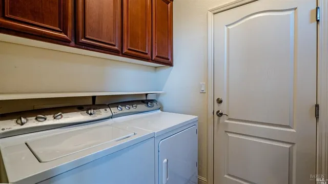 a utility room with washer and dryer