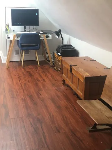 a room with furniture and a flat screen tv