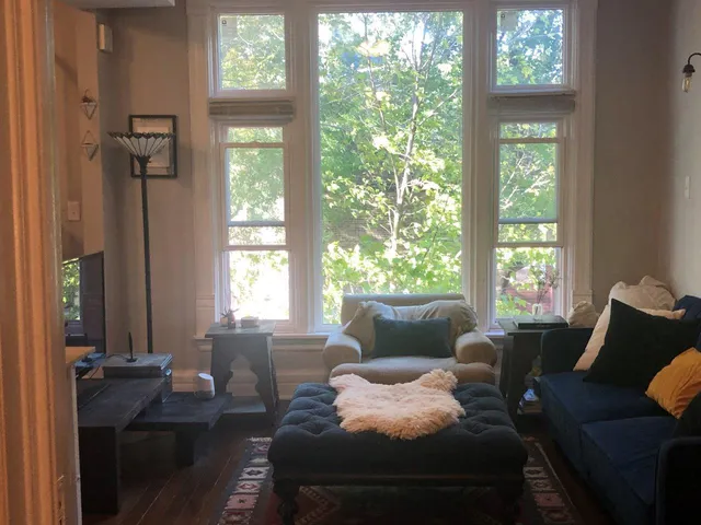 a living room with furniture and a window