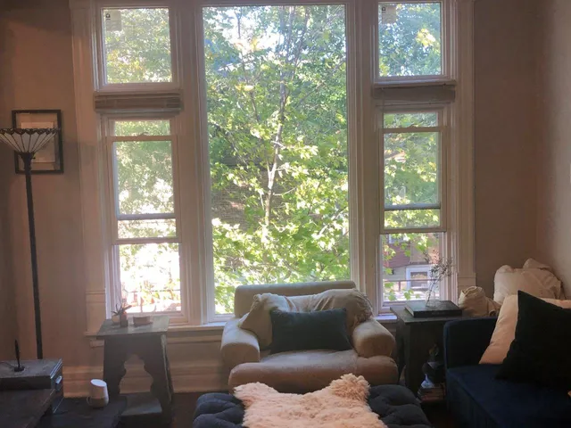 a living room with furniture and a window