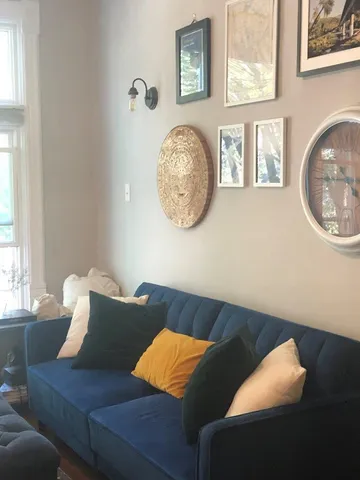 a living room with furniture and a window