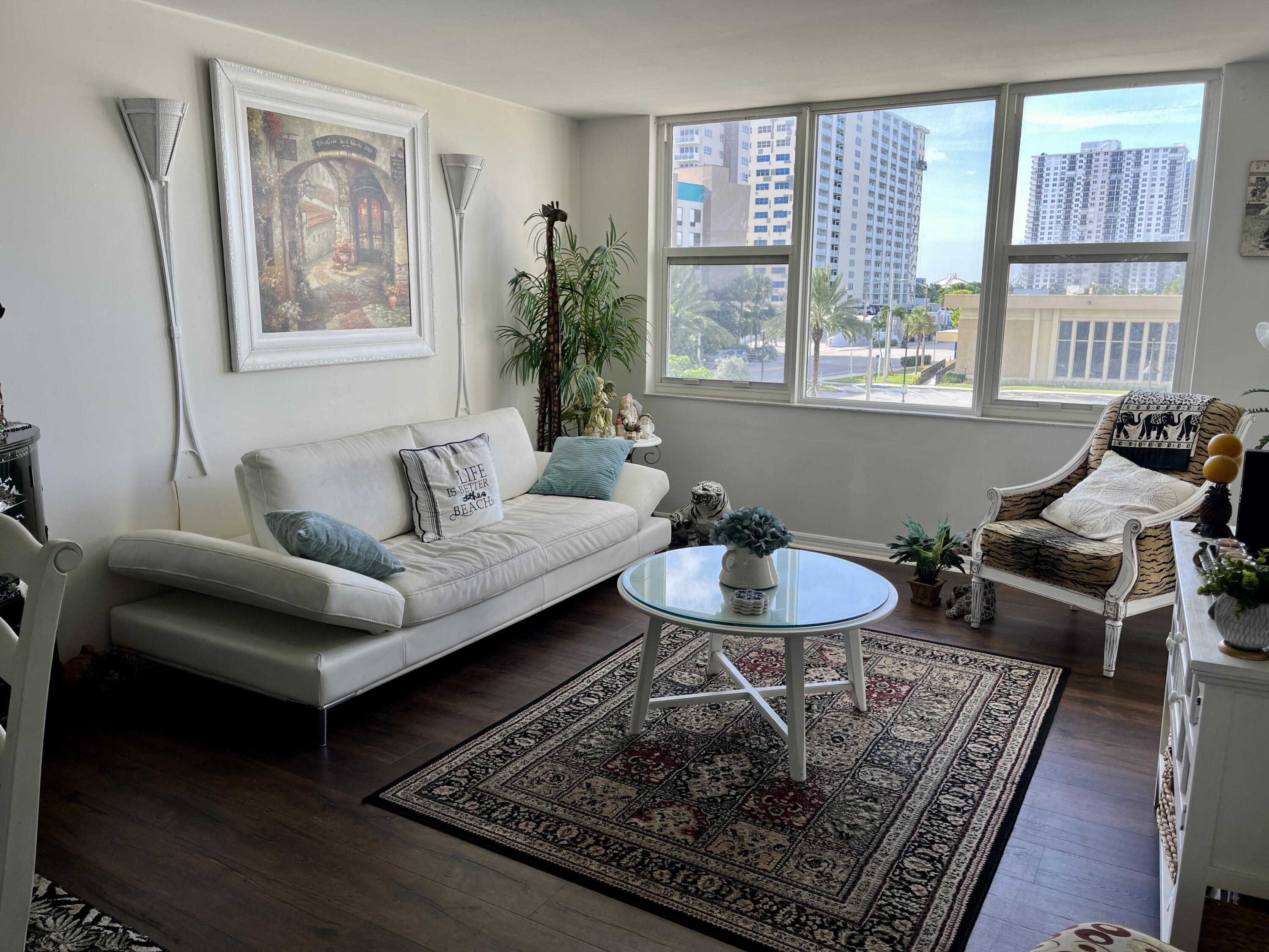 a living room with furniture and a rug