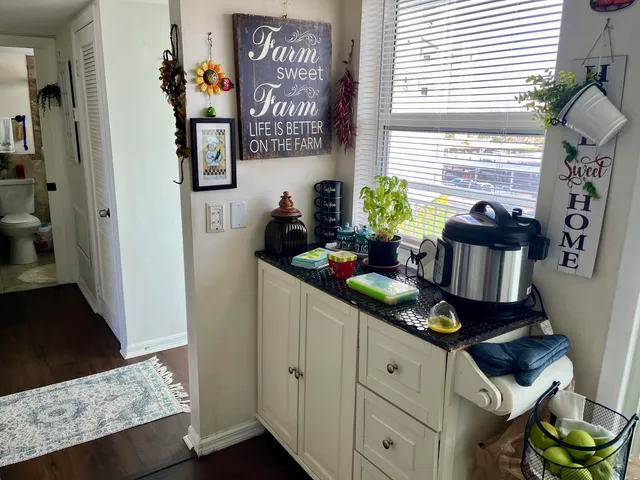 a kitchen with stainless steel appliances granite countertop a stove and a window