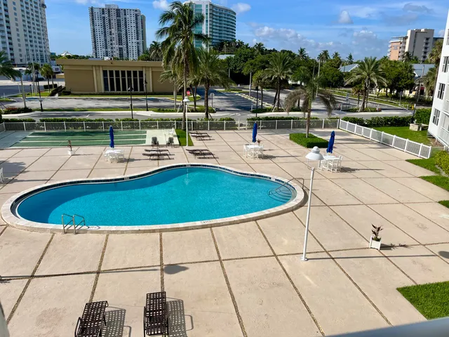 a view of a swimming pool with a patio
