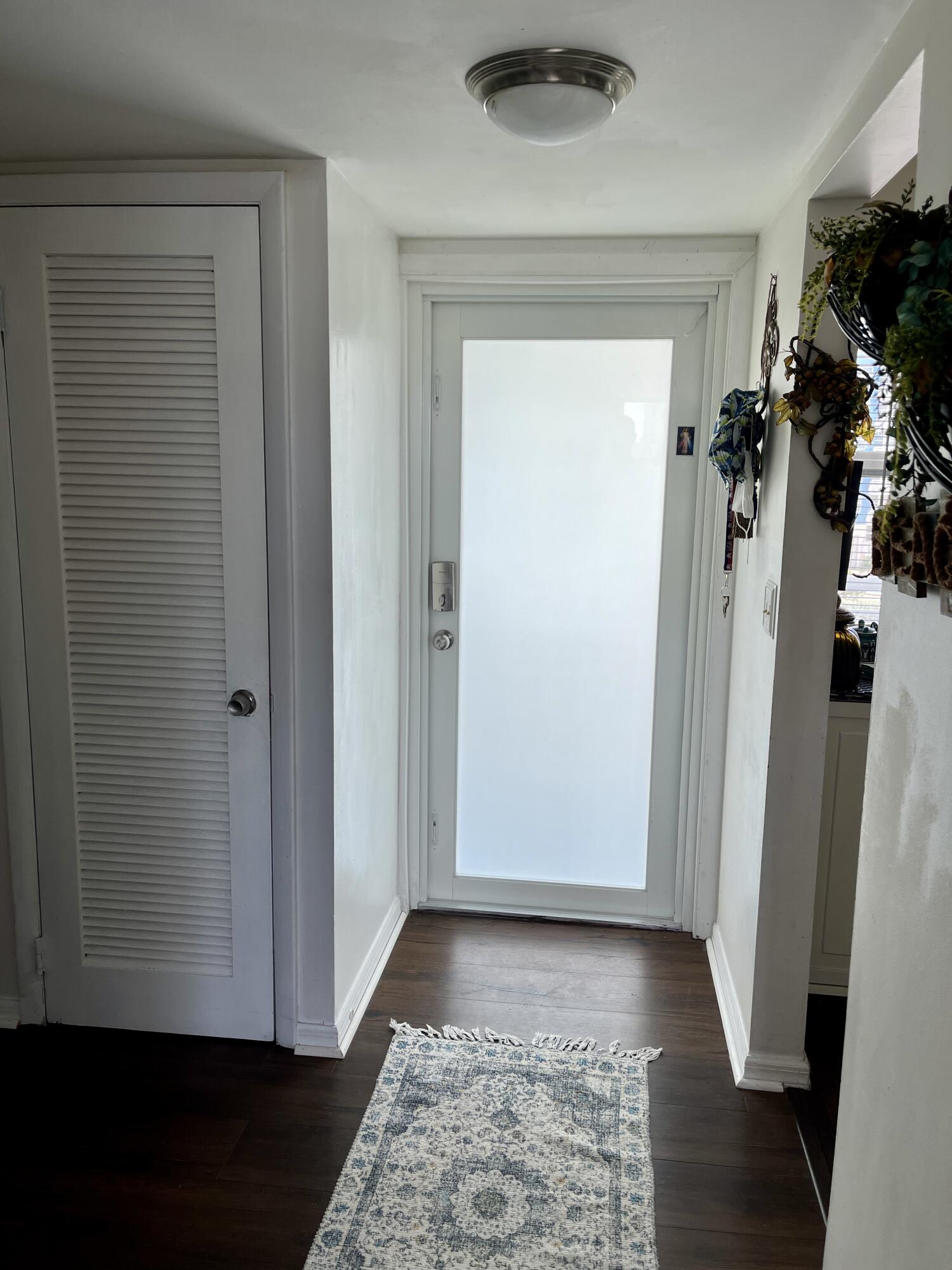 201 North Ocean Boulevard, Unit 302 Pompano Beach, FL 33062 - Photo 31 of 39 a view of a hallway with a glass door