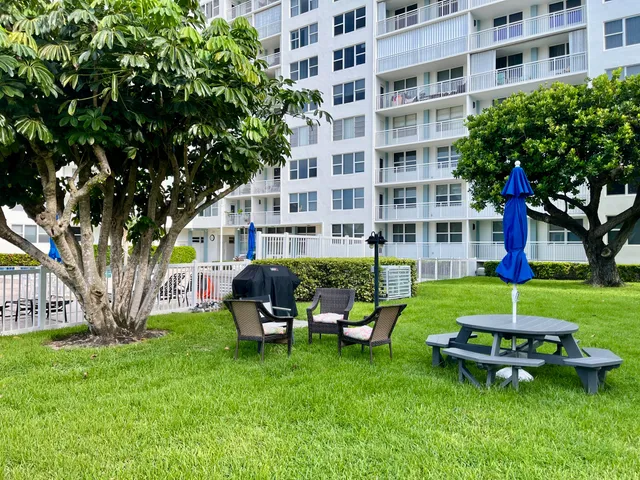 a room with lots of furniture and windows