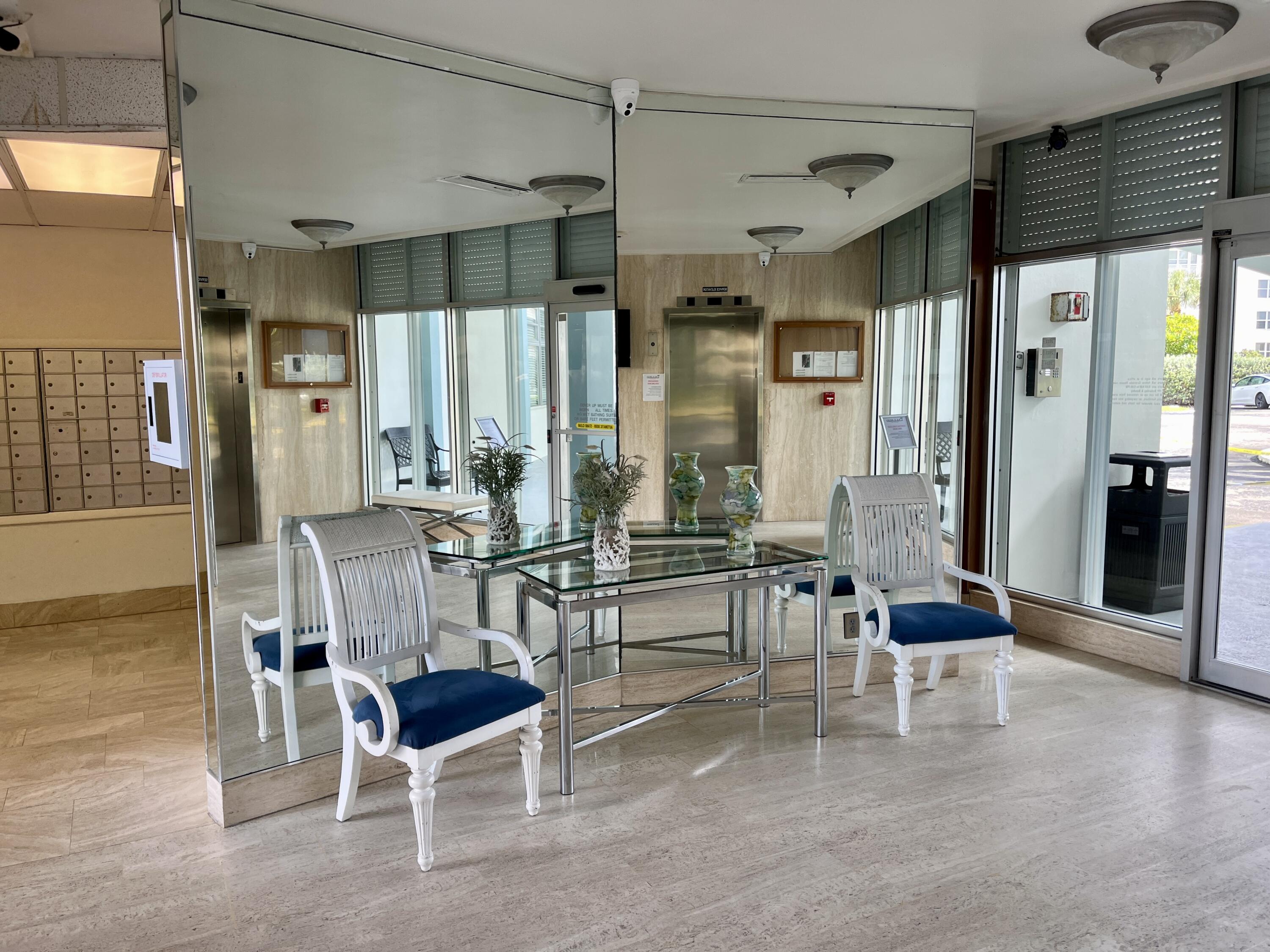 201 North Ocean Boulevard, Unit 302 Pompano Beach, FL 33062 - Photo 34 of 39 a room with lots of furniture and windows