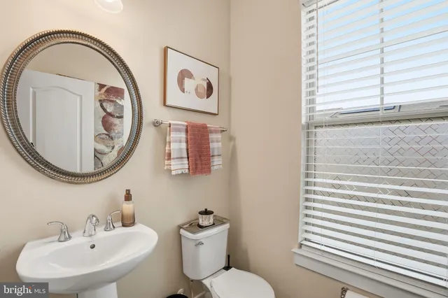 a bathroom with a toilet and a sink