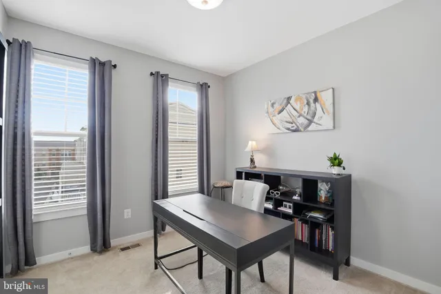 a view of a workspace with furniture