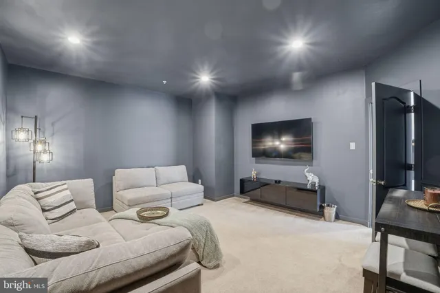 a bedroom with furniture and a flat screen tv