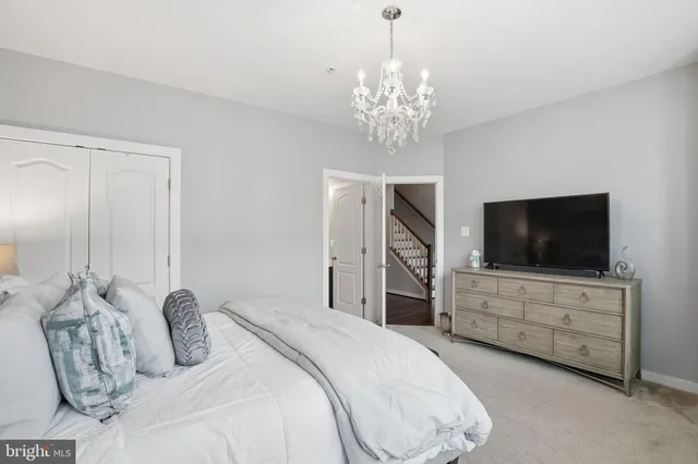 a bedroom with bed and tv