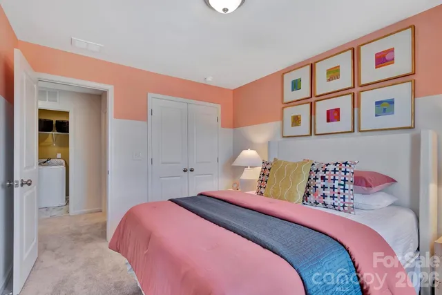 a bedroom with a bed and a book shelf