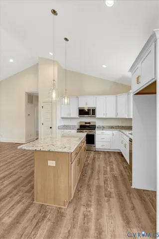 an empty room with window and wooden floor