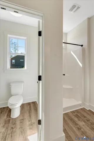 a bathroom with a glass shower door