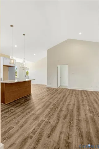 a kitchen with stainless steel appliances granite countertop white cabinets granite counter tops and a window