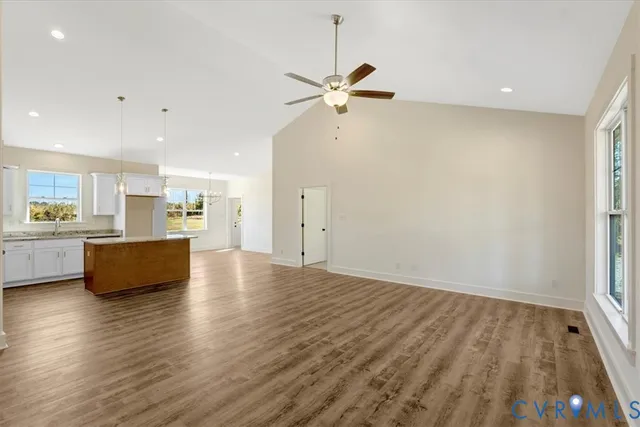 a view of kitchen with furniture and wooden floor