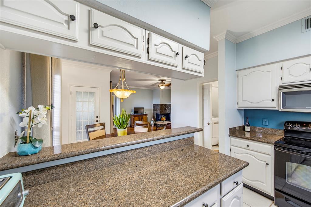 2835 Keller Springs Road, Unit 101 Carrollton, TX 75006 - Photo 11 of 22 Kitchen looking into the dining and living room....