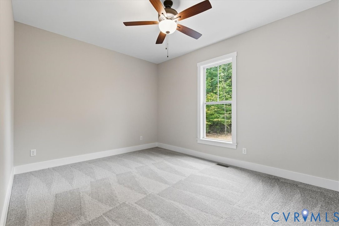 1646 Jerusalem Church Road Buckingham, VA 23921 - Photo 11 of 19 an empty room with a window and a fan