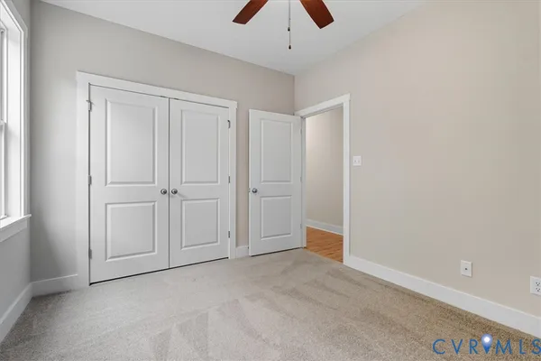 an empty room with closet area