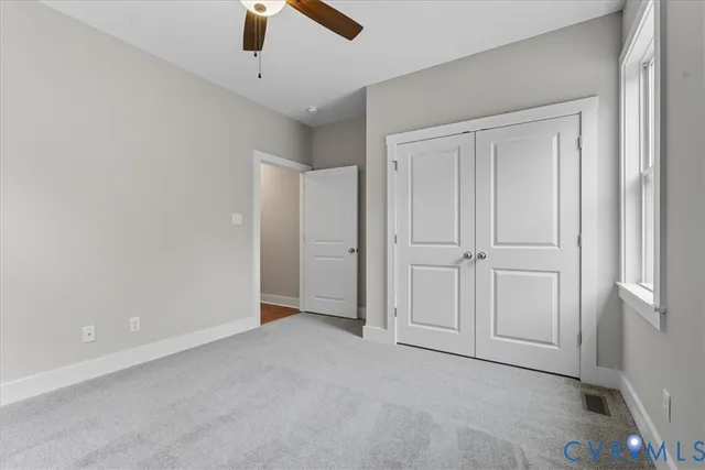 an empty room with closet area