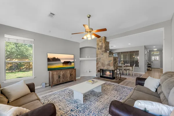 a living room with furniture and a flat screen tv