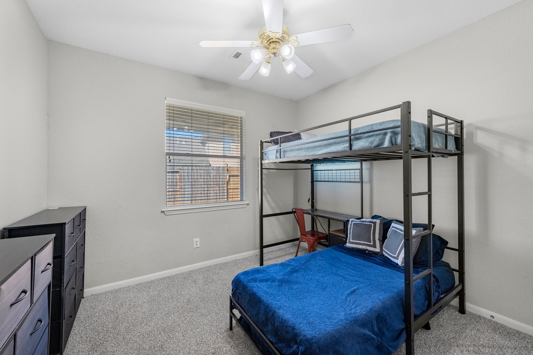 19310 Arbor Breeze Court Spring, TX 77379 - Photo 28 of 37 a bedroom with a bed a desk and chair