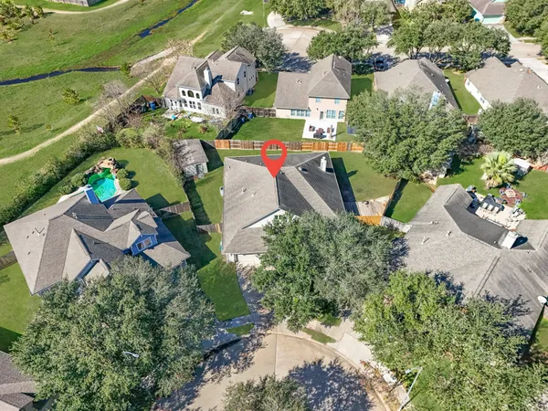 an aerial view of a house with a garden