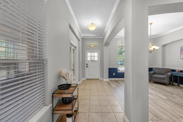 a kitchen with stainless steel appliances a stove a sink a microwave and a refrigerator