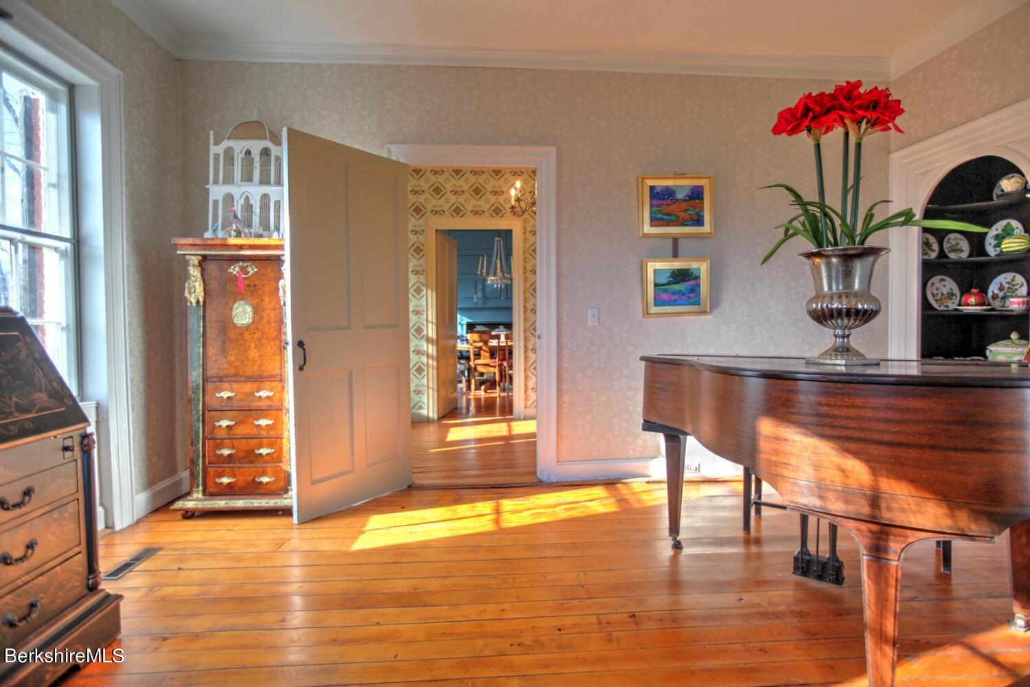 1586 Main Road Granville, MA 01034 - Photo 14 of 44 a view of an entryway with wooden floor and a potted plant