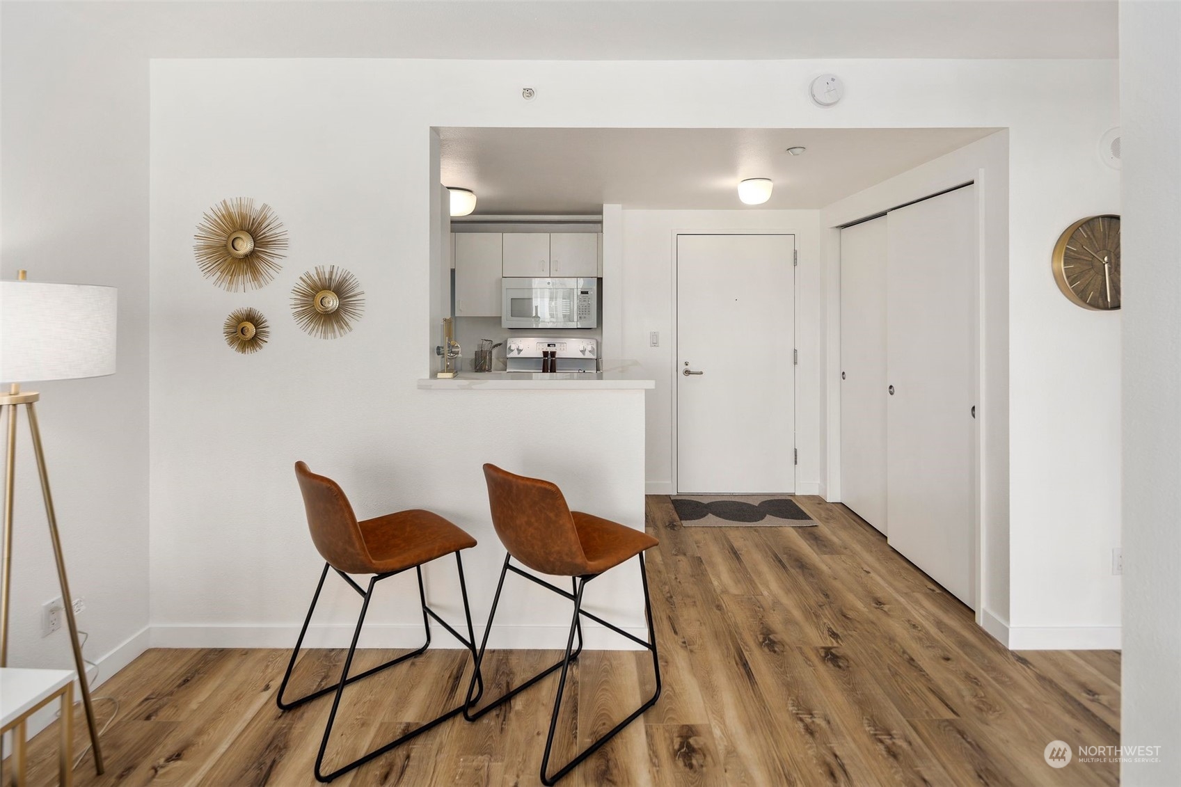 1415 2nd Avenue, Unit 2008 Seattle, WA 98101 - Photo 12 of 36 a view of a dining room with furniture and wooden floor