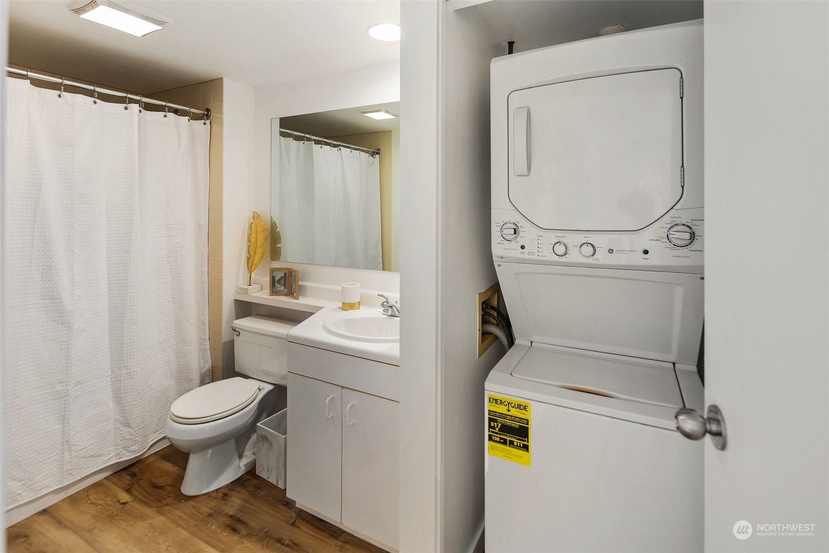 1415 2nd Avenue, Unit 2008 Seattle, WA 98101 - Photo 18 of 36 a bathroom with a sink and toilet