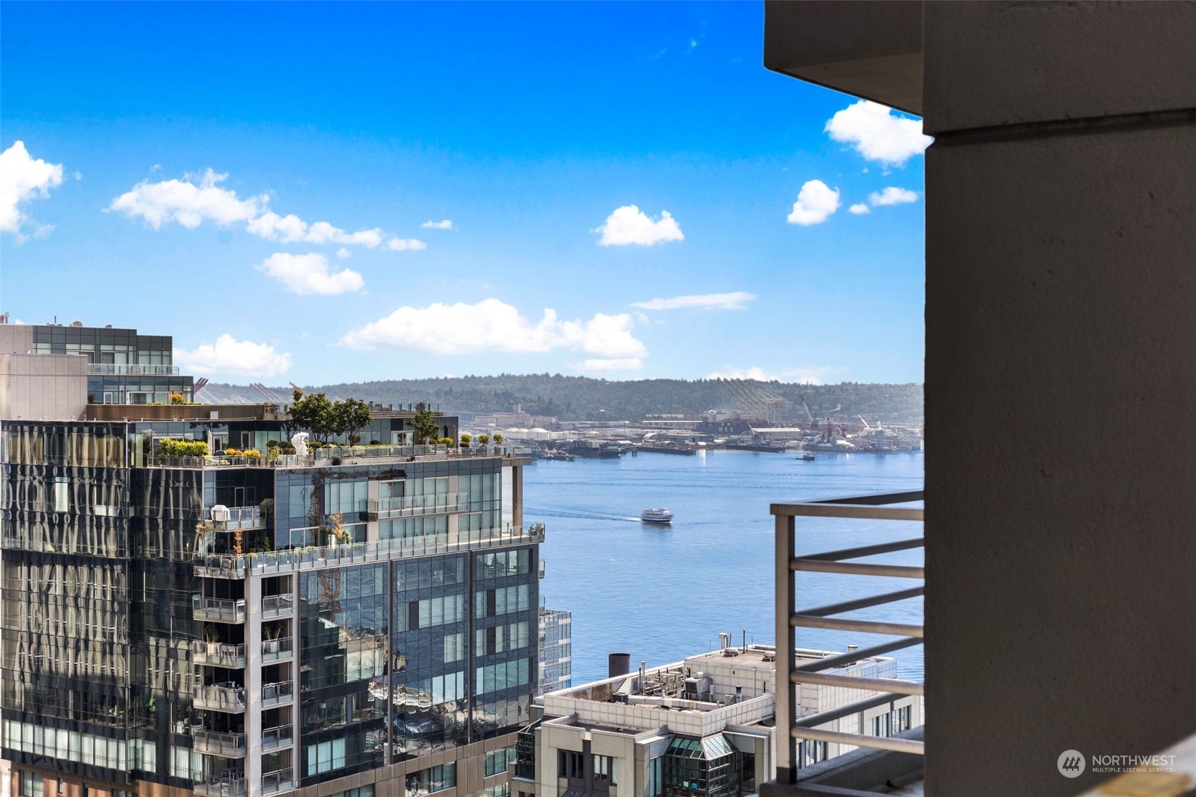 1415 2nd Avenue, Unit 2008 Seattle, WA 98101 - Photo 2 of 36 a view of a city with tall buildings