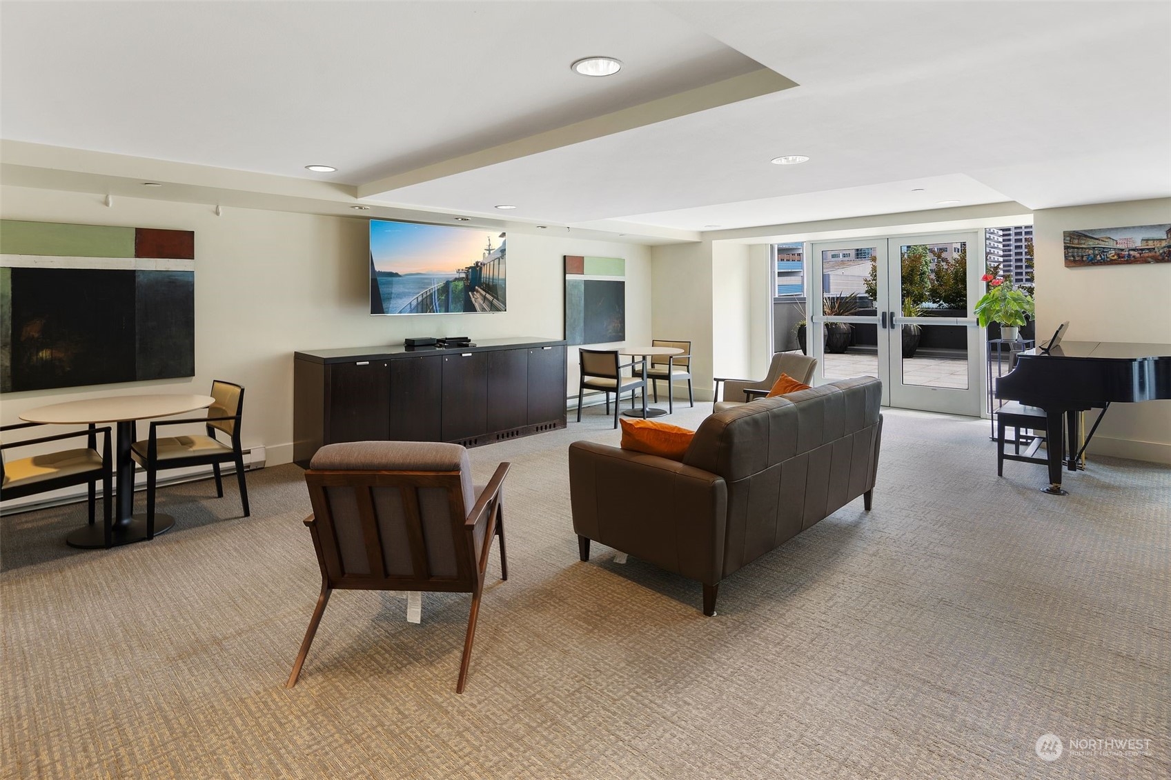 1415 2nd Avenue, Unit 2008 Seattle, WA 98101 - Photo 25 of 36 a living room with furniture and a flat screen tv