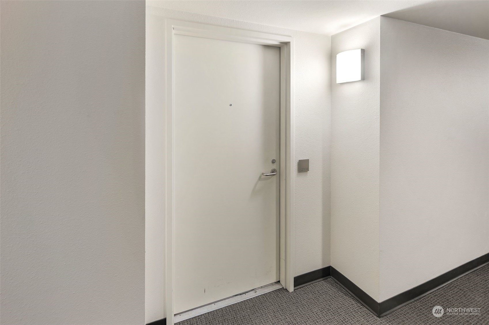1415 2nd Avenue, Unit 2008 Seattle, WA 98101 - Photo 3 of 36 a view of a hallway with closet area