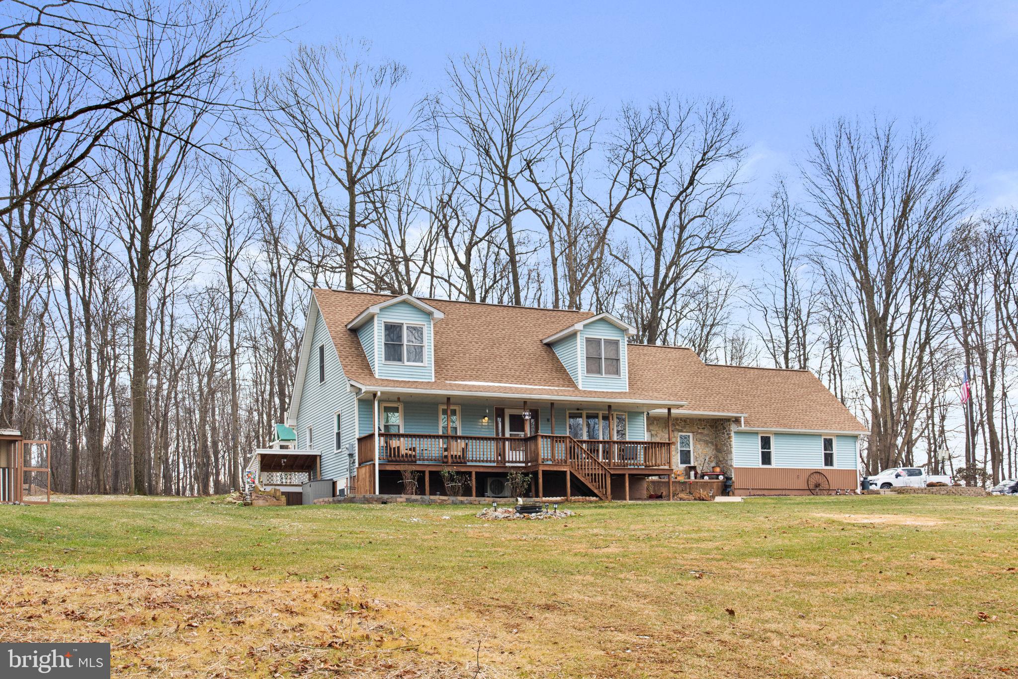 19773 Haugh Road Stewartstown, PA 17363 - Photo 2 of 58 a view of a big house with swimming pool and a chairs