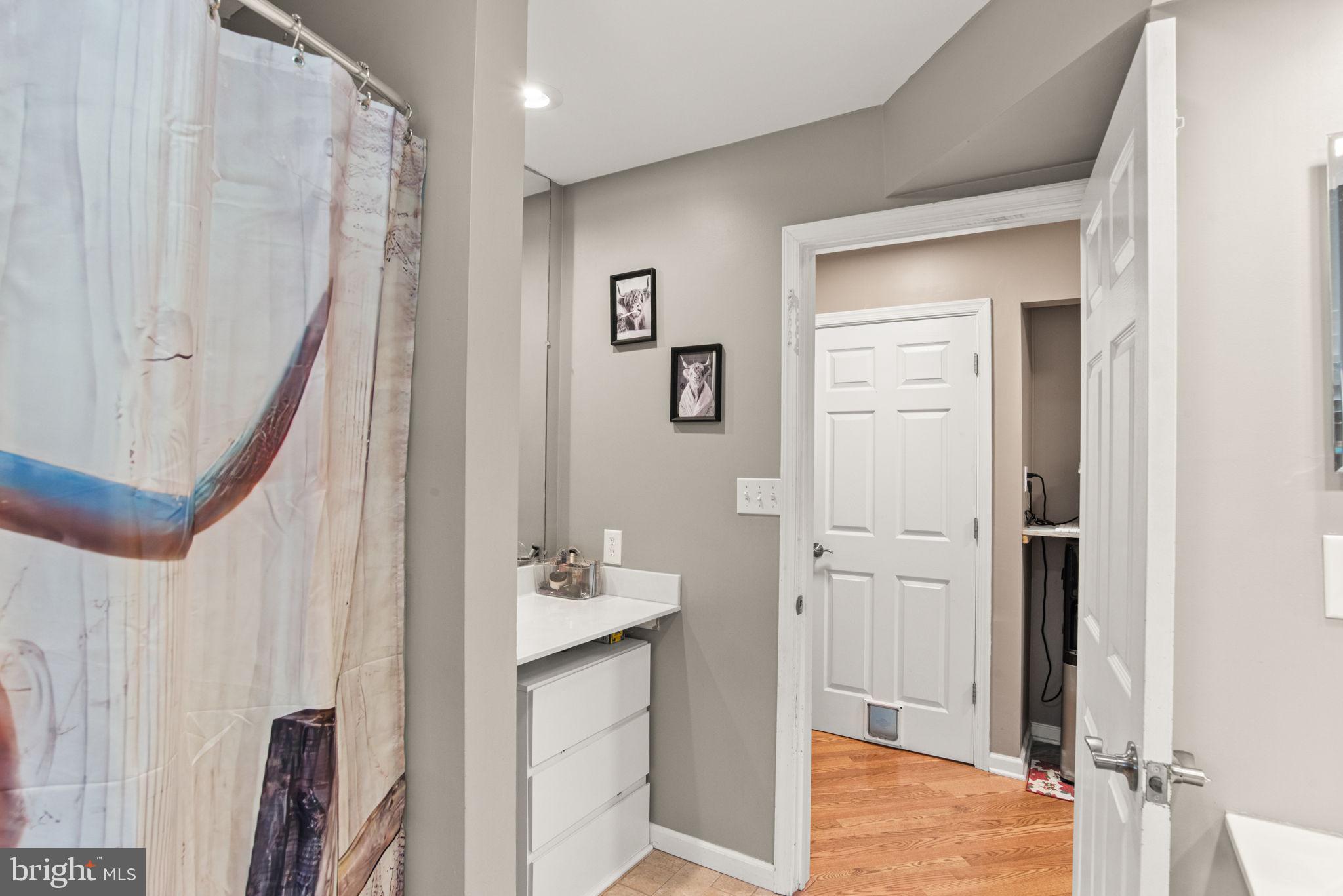 19773 Haugh Road Stewartstown, PA 17363 - Photo 21 of 58 a bathroom with a bathtub sink and mirror