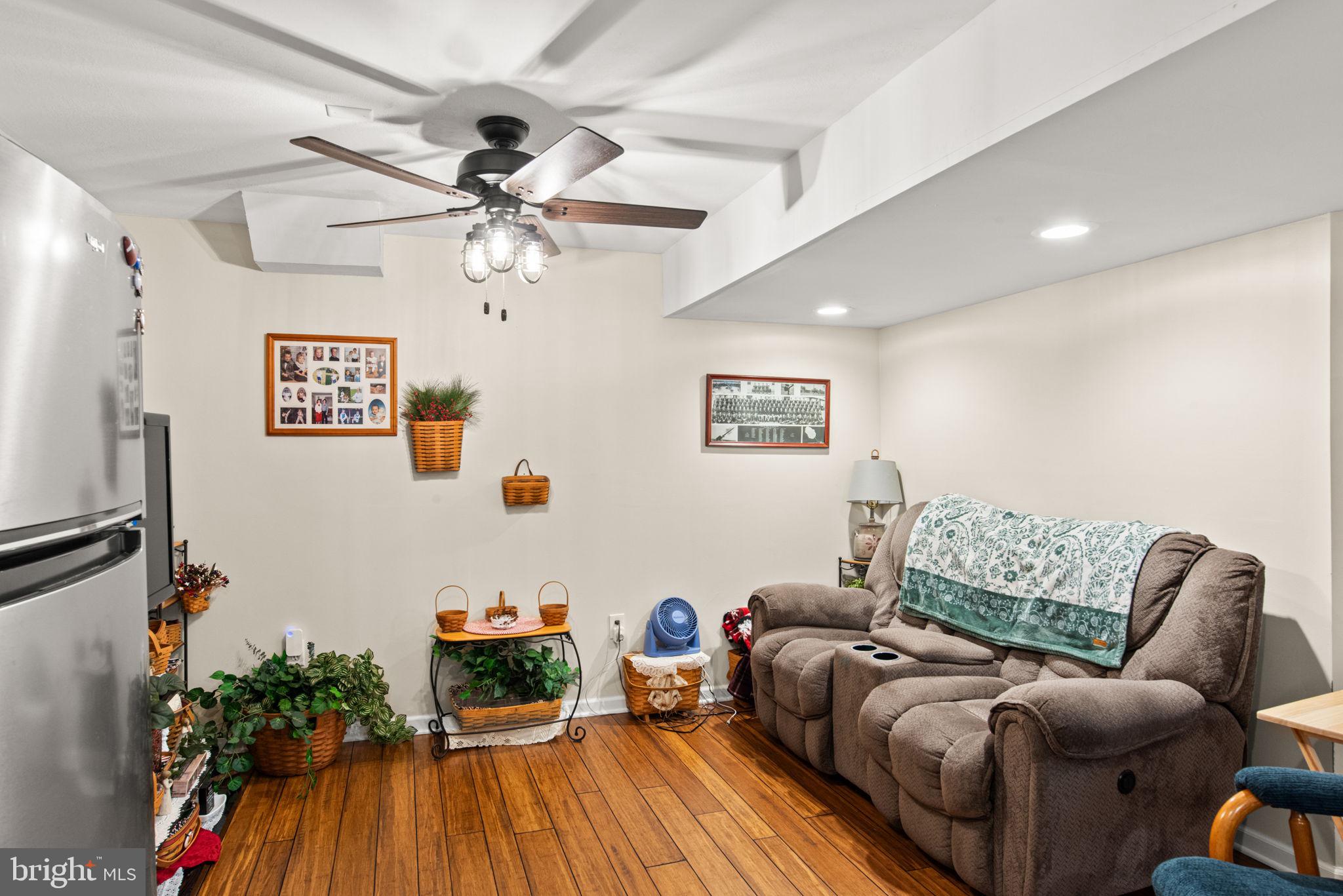 19773 Haugh Road Stewartstown, PA 17363 - Photo 49 of 58 a living room with furniture and a wooden floor