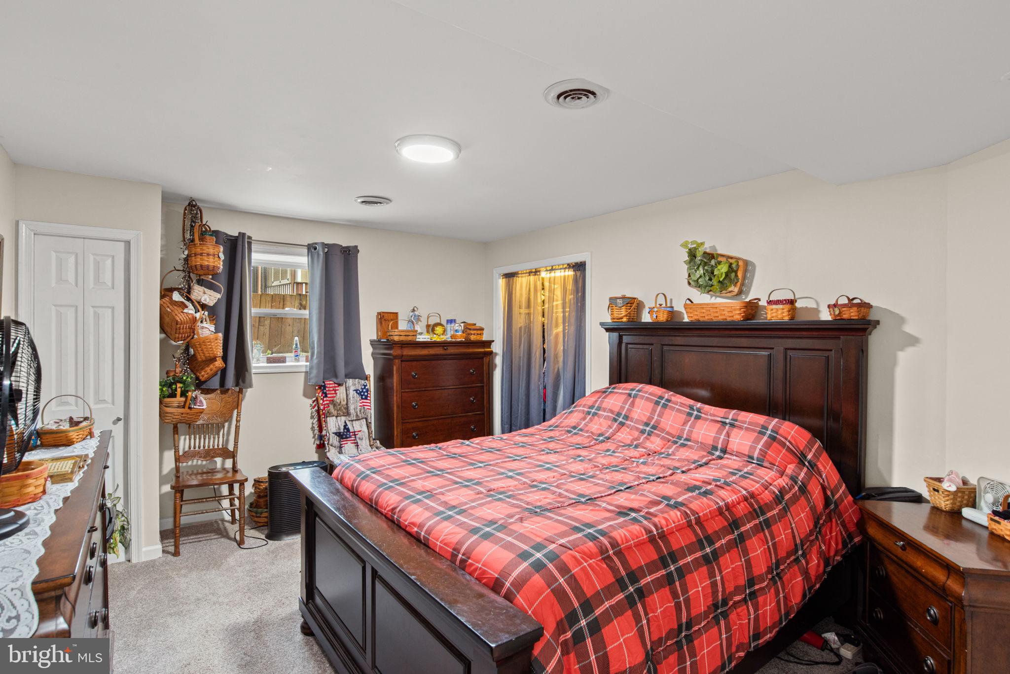 19773 Haugh Road Stewartstown, PA 17363 - Photo 50 of 58 a bedroom with a bed and dresser