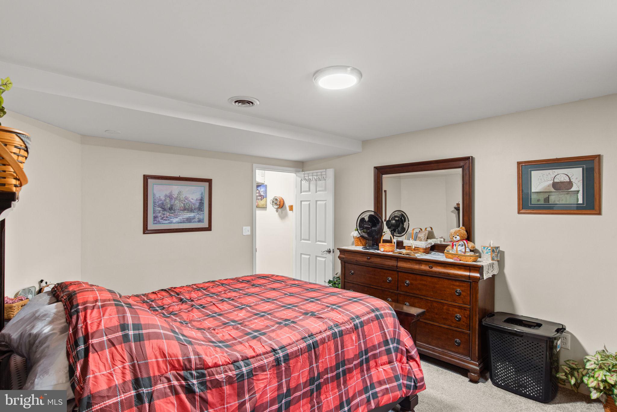 19773 Haugh Road Stewartstown, PA 17363 - Photo 51 of 58 a bedroom with a bed and a dresser in it