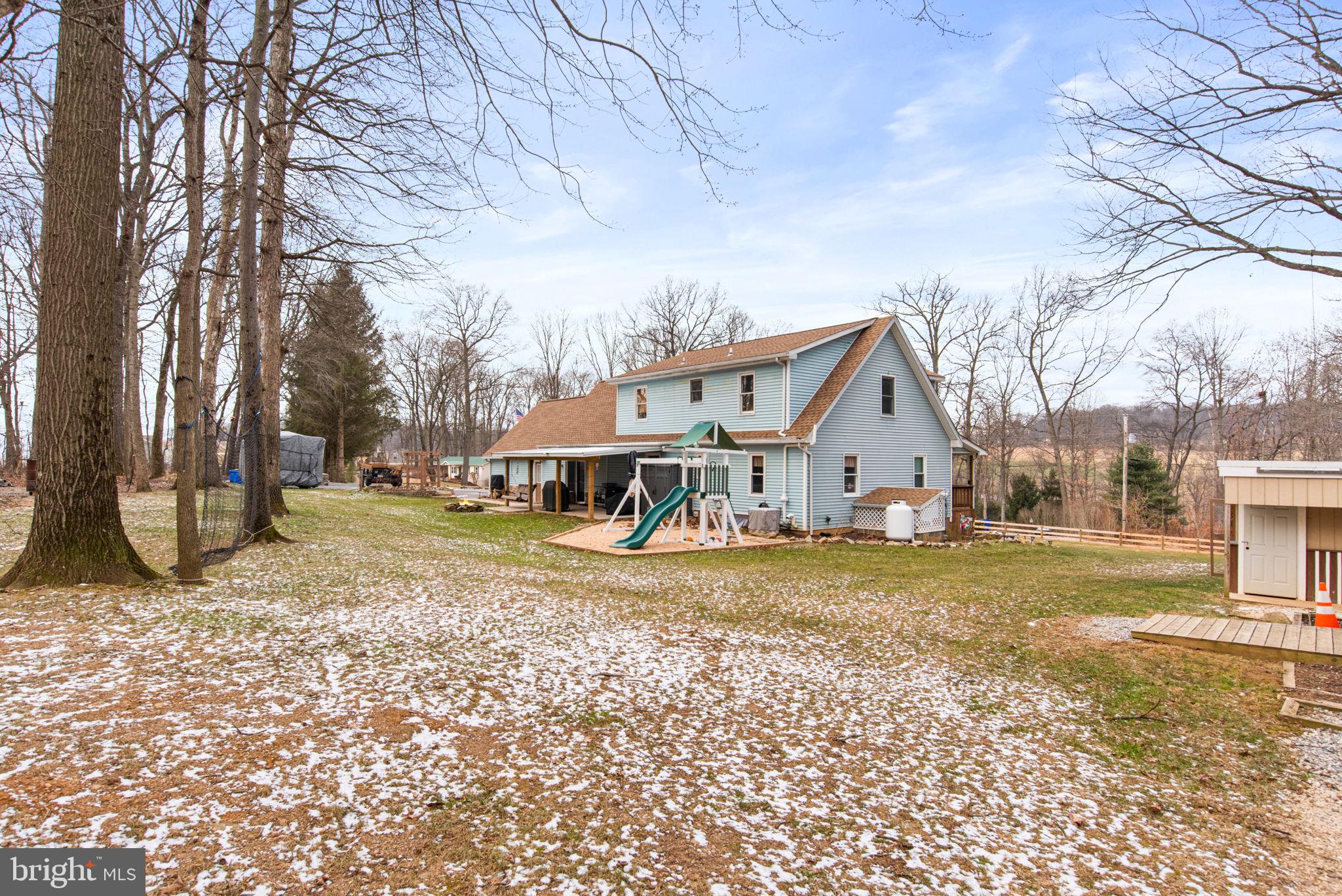 19773 Haugh Road Stewartstown, PA 17363 - Photo 55 of 58 a view of a house with a yard covered in snow