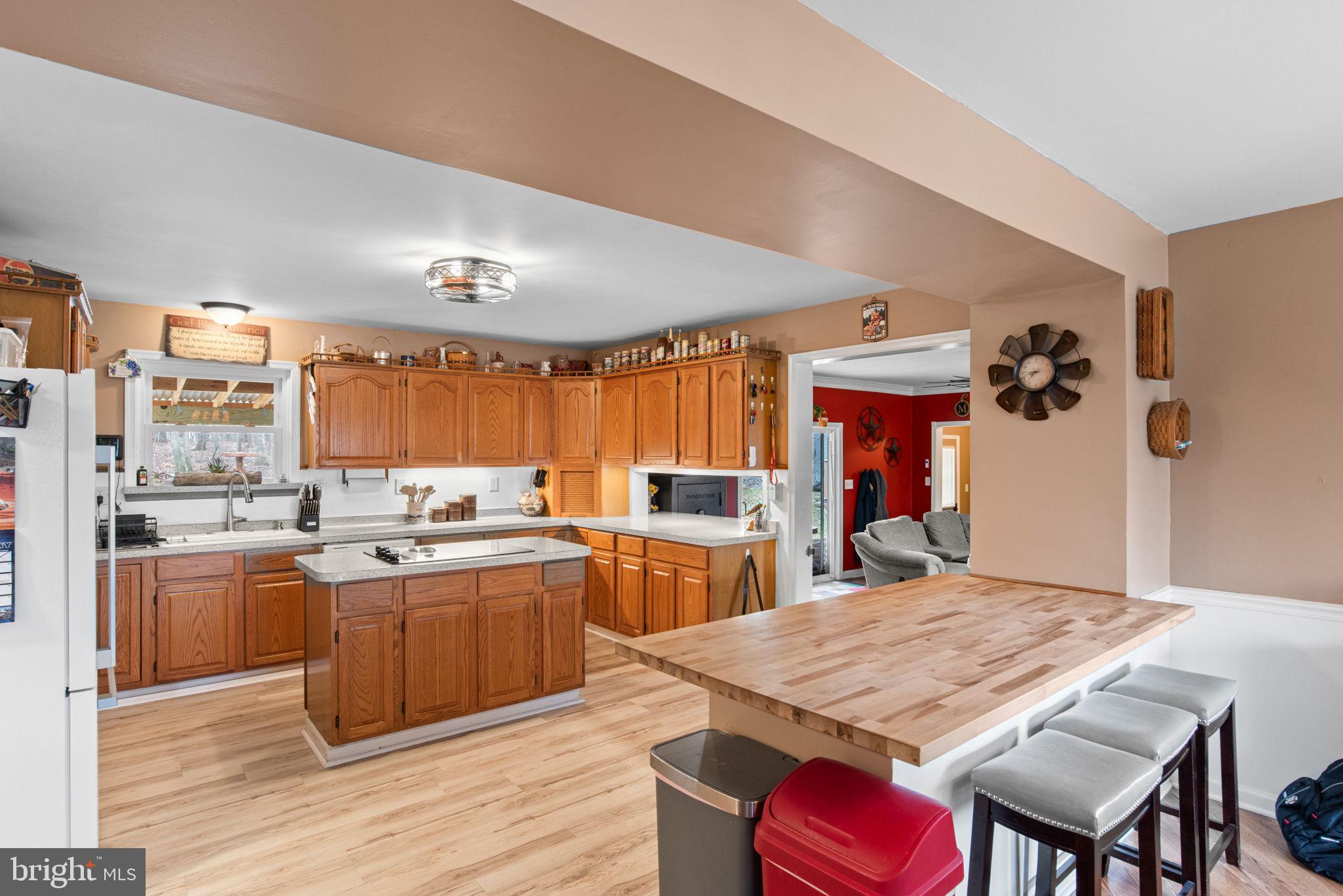 19773 Haugh Road Stewartstown, PA 17363 - Photo 10 of 58 a large kitchen with kitchen island a sink table and chairs