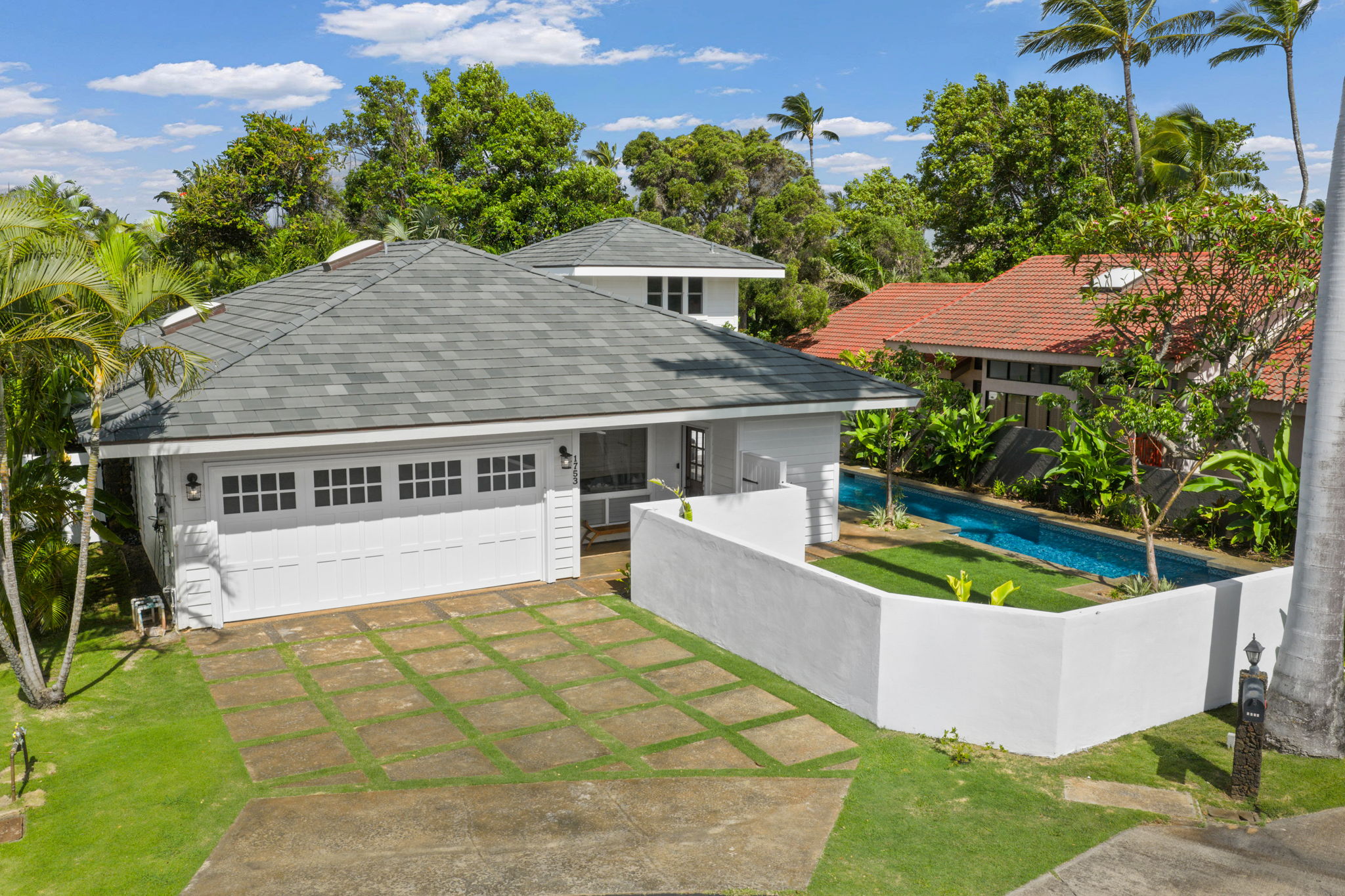 1753 Kelaukia Street Koloa, HI 96756 - Photo 1 of 27 a view of a house with a yard and sitting area