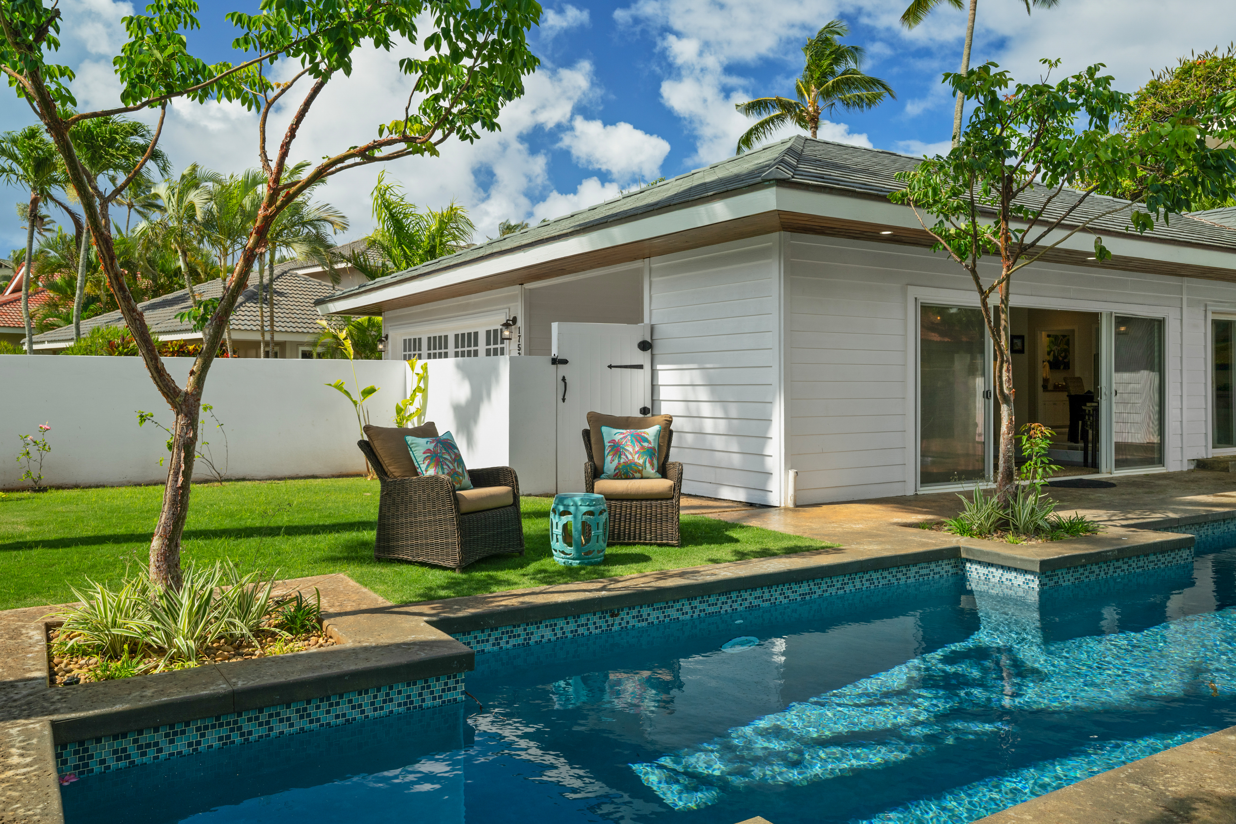 1753 Kelaukia Street Koloa, HI 96756 - Photo 4 of 27 a front view of a house with garden