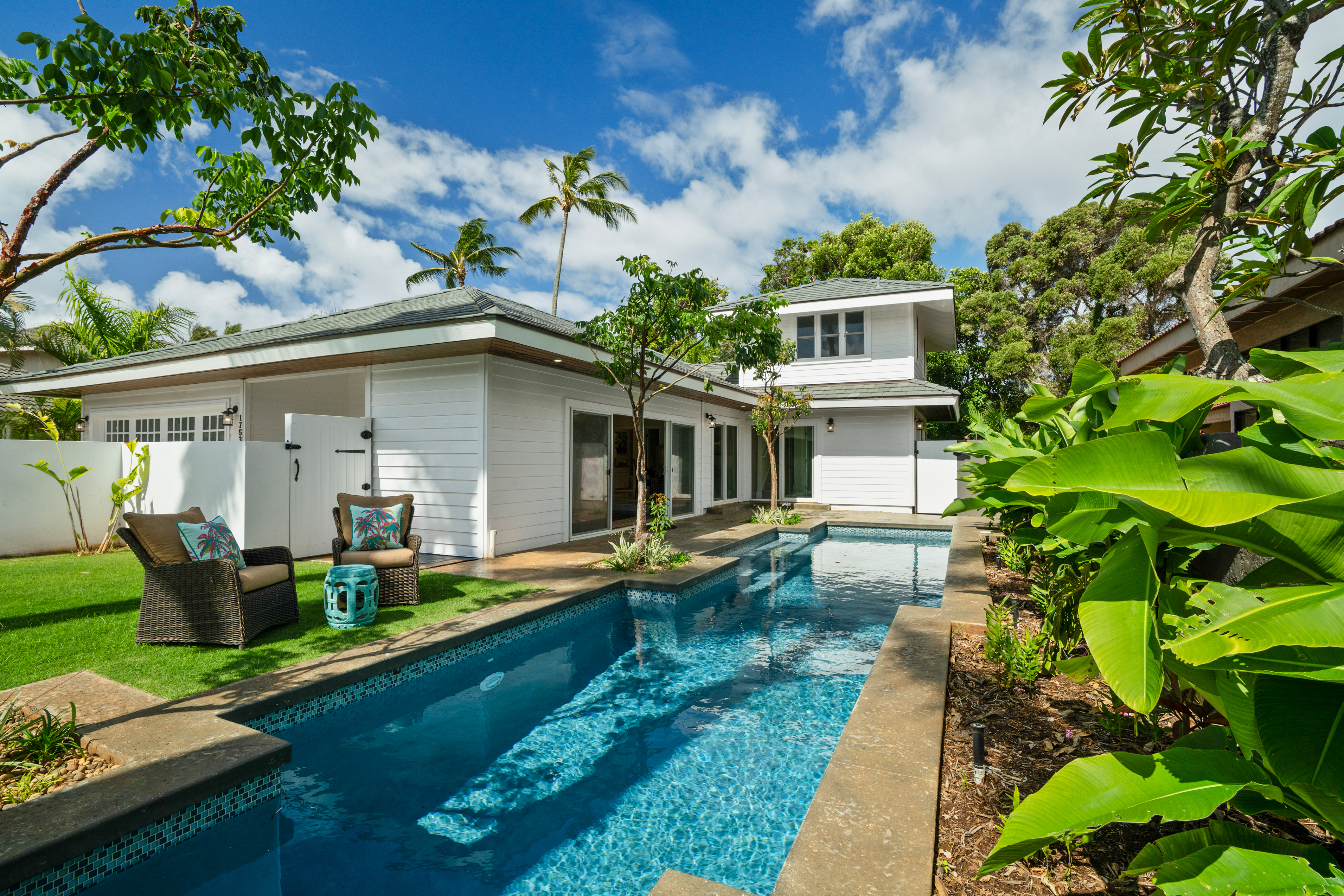 1753 Kelaukia Street Koloa, HI 96756 - Photo 5 of 27 a front view of house with yard and outdoor seating