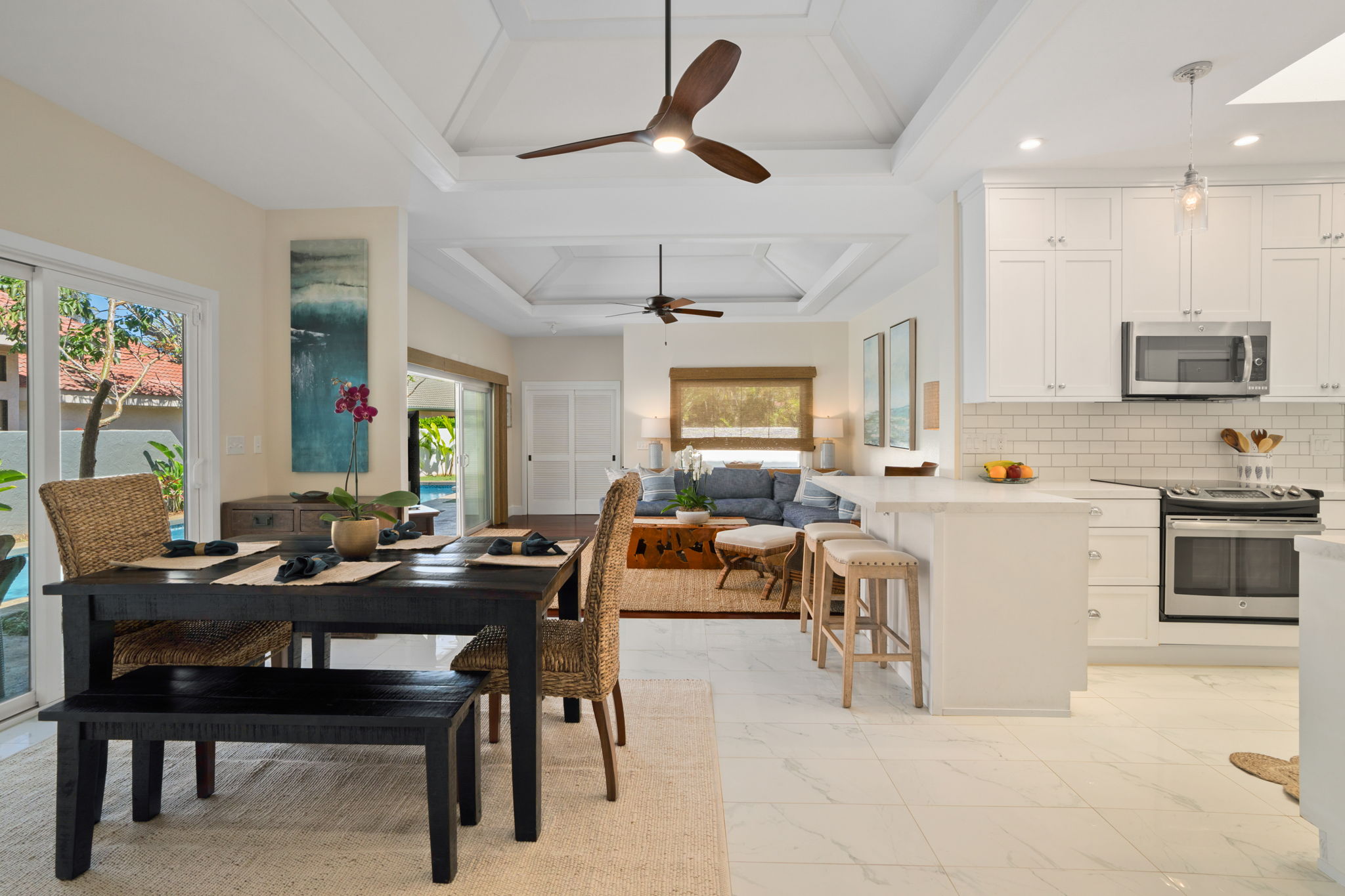 1753 Kelaukia Street Koloa, HI 96756 - Photo 8 of 27 a view of kitchen with cabinets table and chairs