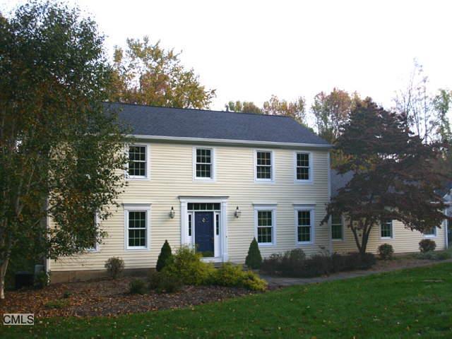 19 Keeler Place Ridgefield, CT 06877 - Photo 1 of 1 a view of a white house next to a yard with big trees