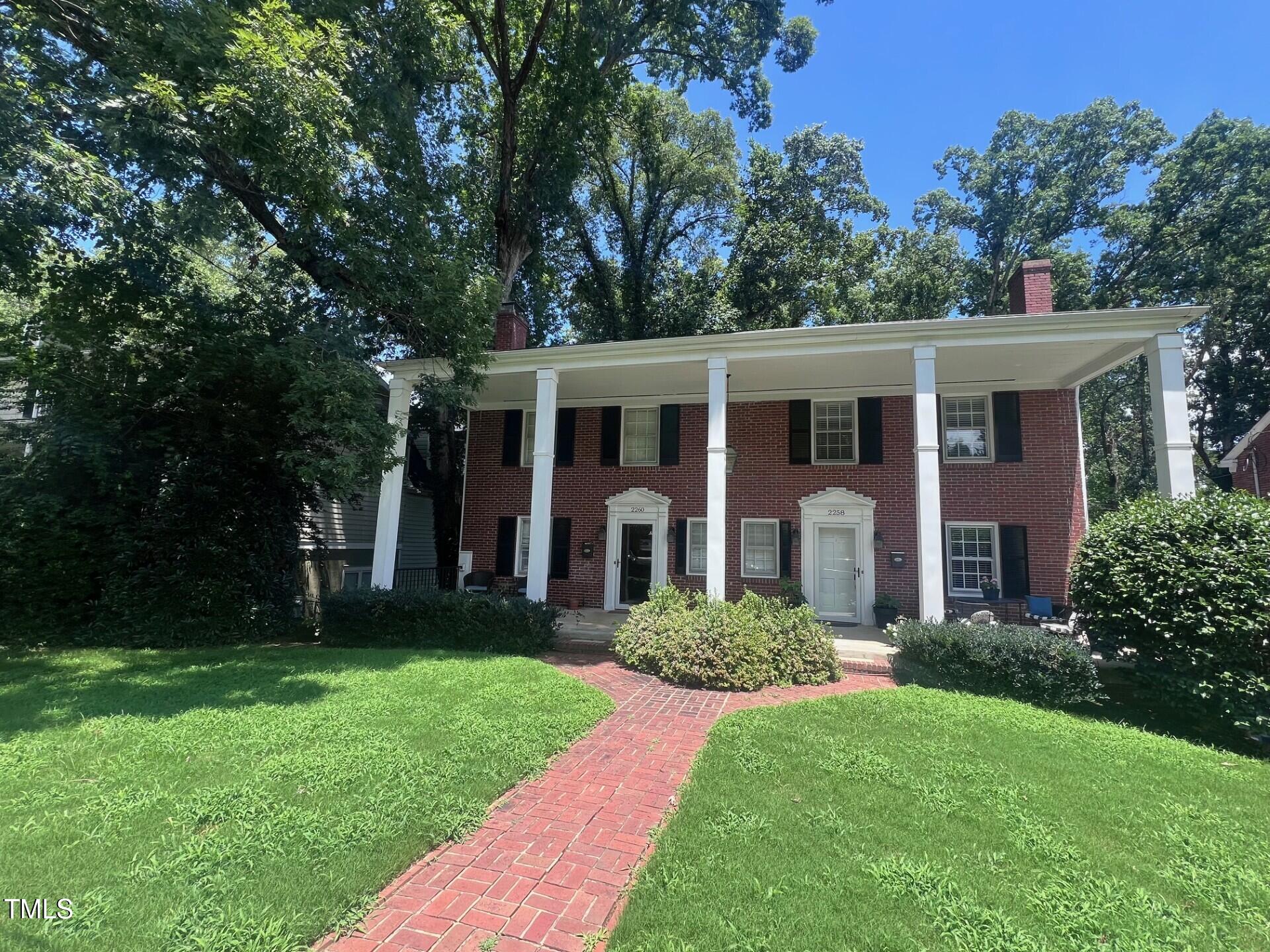 front view of a house with a yard