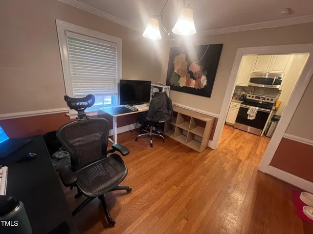 a view of a livingroom with furniture and a flat screen tv