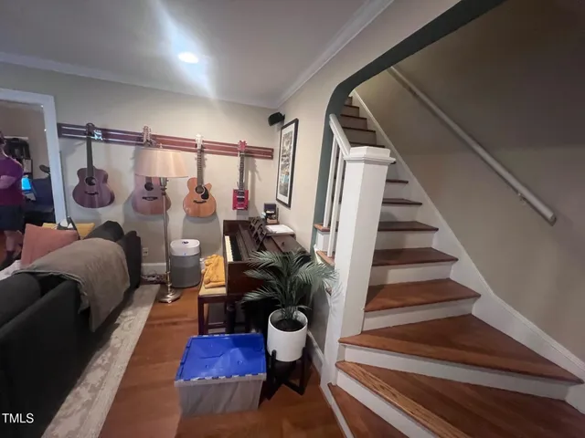 a bedroom with furniture and a potted plant